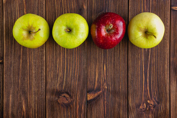 A few fresh apples on a wooden background