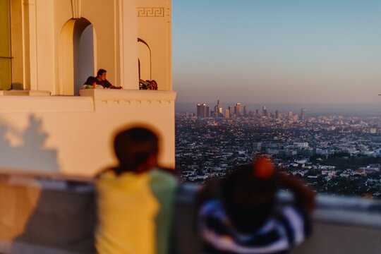 Poeple looking out from the Griffith Observatory, Los angeles, California, USA.