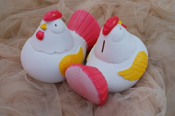 Chicken shaped ornament in white and red colors