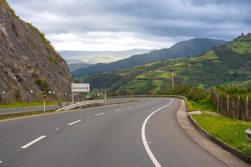 Curve on a highway in a Colombian countryside in the Andes mountains.