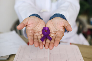 Doctor Hand Showing Purple Ribbon On Palms For Support Alzheimer And Pancreatic Cancer. World Lupus Day