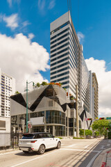 Obraz premium Highrise towers Brickell Miami. Florida USA. Summer scene 2024. Car waiting at red light.