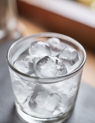 Ice filled in a transparent glass cup. close up