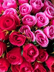 Close-Up View of Red and Pink Roses in a Bouquet