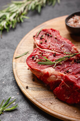 Raw beef meat on a wooden tray