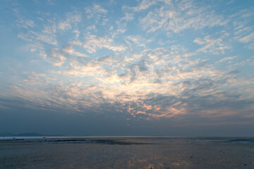 View of the sunset on the beach in winter