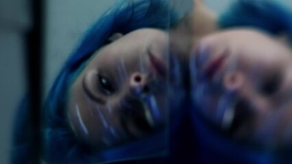 Vertical video. Depressed woman. Blur face. Sad unhappy female bad mood troubled mind relationship problems melancholy defocused light reflect motion.