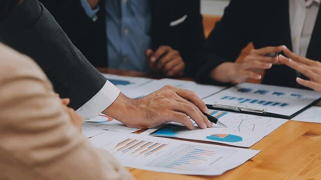 Team of business people are meeting to analyze data for marketing plan,Market research reports and income statistics, Financial and Accounting concept.