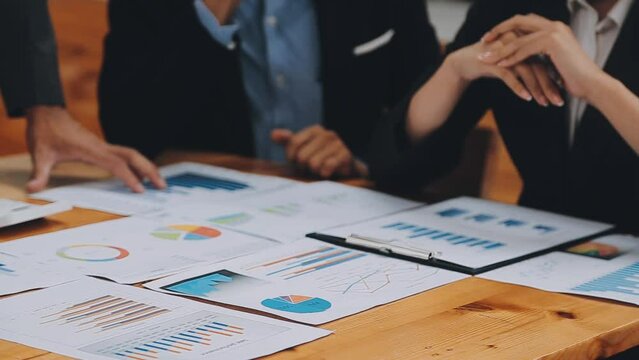Team of business people are meeting to analyze data for marketing plan,Market research reports and income statistics, Financial and Accounting concept.