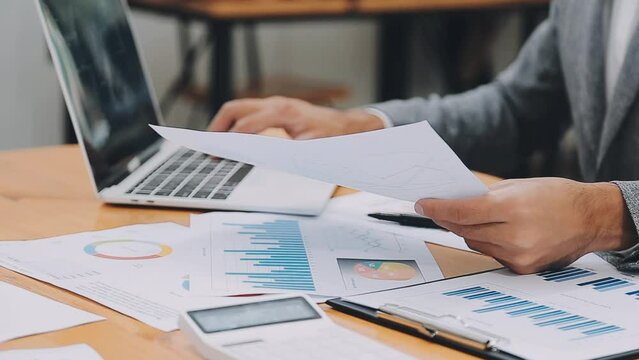 Team of business people are meeting to analyze data for marketing plan,Market research reports and income statistics, Financial and Accounting concept.