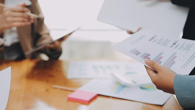 Team of business people are meeting to analyze data for marketing plan,Market research reports and income statistics, Financial and Accounting concept.