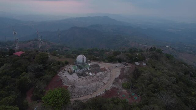Orbit drone shot of Cerro Azul, a fishing village that was once a commercial port in Ca&ntilde;ete Province, Lima Region, Peru. View of the mountain peak of Parque Nacional Cerro Azul, Me&aacute;mbar.