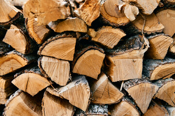 Rustic firewood pile in a cozy outdoor setting, perfect for a winter evening by the fire