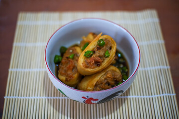 Homemade chicken gohyong or Ngo Hyong, Chinese Food Made from Minced Chicken Wrapped in Flour.