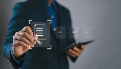 E-document management, online documentation database, paperless office concept, Businessman touching on document for online approve paperless quality assurance and ERP management concept.