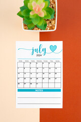 July 2024 calendar page with plant pot.