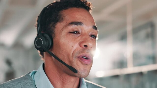 Businessman, consultant and talking with headphones at call center for customer service, support or telemarketing at office. Friendly man, young agent or employee consulting for online advice or help