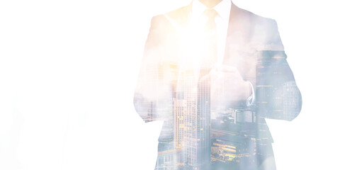 Double exposure of a businessman in a suit with a modern cityscape and sunset, symbolizing corporate success and urban growth.
