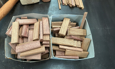 Wood dowel blocks for furniture joinery in workshop.