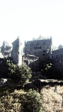 Old ruined castle in the misty mountains