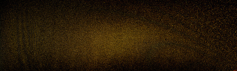 Golden fine sand explosion, top view isolated on black background. Sand explosion isolated on black background. Freeze motion of sandy dust splash. Sand gold texture concept.