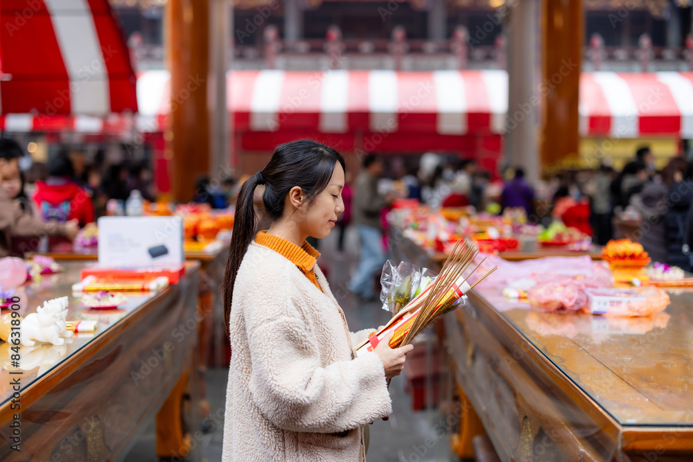 Canvas Prints asian woman pray in chinese temple