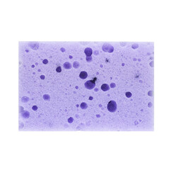 A close-up image of a light purple sponge with numerous circular holes