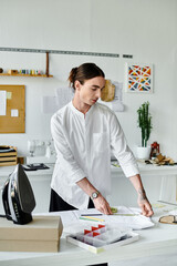 A young designer meticulously measures fabric in his DIY clothing restoration atelier, transforming...