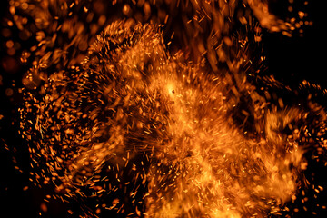 fire flame with sparks on black background.