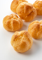 Cream puffs placed on a white background.