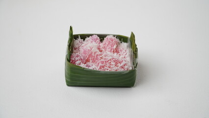 Cenil is traditional food from Indonesia. Usually served with grated coconut and sugar isolated on white background