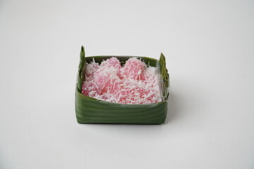 Cenil is traditional food from Indonesia. Usually served with grated coconut and sugar isolated on white background