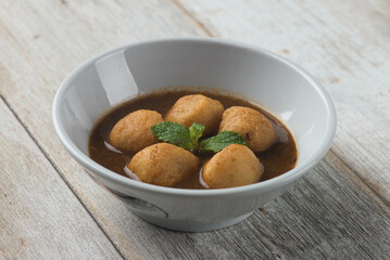 Curry fish balls served on bowl