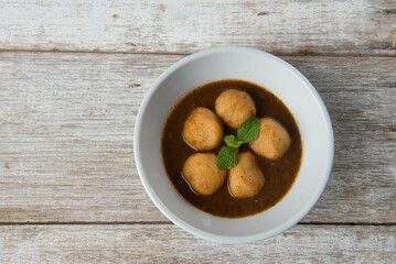 Curry fish balls served on bowl