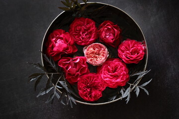 red roses Bouquet Arrangement in a silver Bowl with Black background