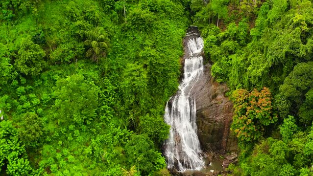 Waterfall in the jungle. Sri Lanka. Kuda Falls in the rainforest.