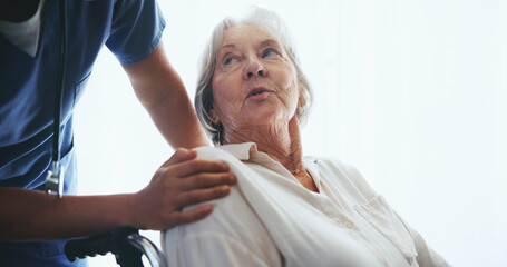 Obraz premium Senior, woman and caregiver for support in wheelchair with assisted living, rehabilitation or trust for assistance. Elderly patient, nurse and talking for wellness, helping hand or healing in hospice