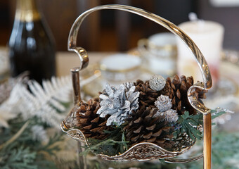 Pine cones on the dining table in the room during the Christmas season