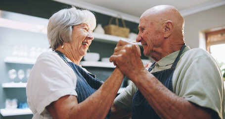 Fototapeta premium Kitchen, dance and senior couple in home for love, bonding relationship and commitment together. Marriage, happy and elderly man and woman cooking together for wellness, meal prep and health in house