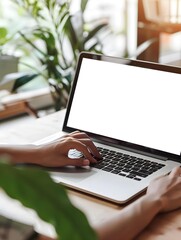 Young woman using laptop computer at home. Blank empty white screen mock up. Freelance, student lifestyle, education, web conference, video call, technology and online shopping concept