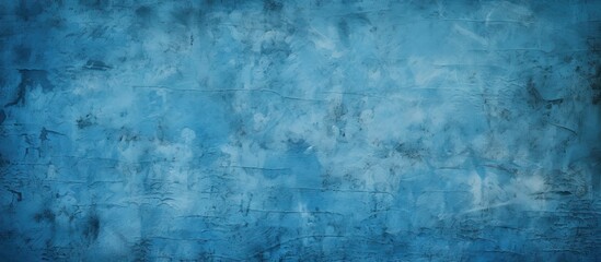 Fototapeta premium An abstract grunge background featuring a blue decorative plaster texture and a vignette effect It provides ample copy space for design purposes