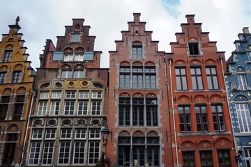 Fototapeta premium A row of historic stepped gable houses, showcasing traditional European architecture and brickwork design