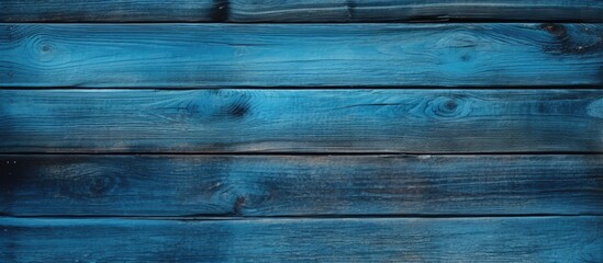Obraz premium A blue panel with a wood texture creates a captivating background in this copy space image