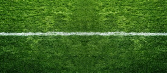 A copy space image captures the aerial perspective of an American football field with artificial turf showcasing the prominent 50 yard line