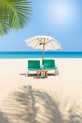 Beach chair with white umbrella on tropical beach, vertical style, summer outdoor day light, it's summer time