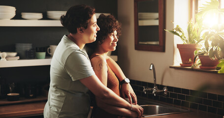 Women, couple and lesbian in kitchen with affection for trust .to relax and enjoy. Support, care and happy on hug with smile to chill, fun and bonding in home for partnership or relationship