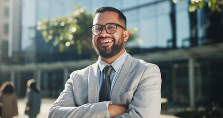 Businessman, portrait and arms crossed in outdoor on break at office building as account manager in...