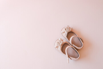 Beautiful shoes for a girl on a pastel background