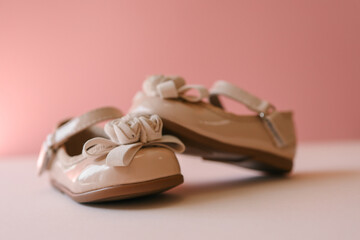 Beautiful shoes for a girl on a pastel background