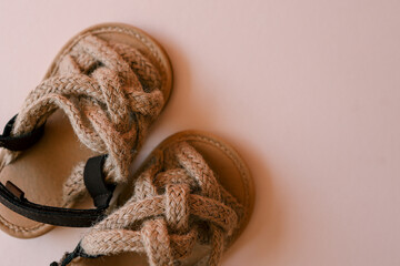 Children's sandals on pastel background, fashion